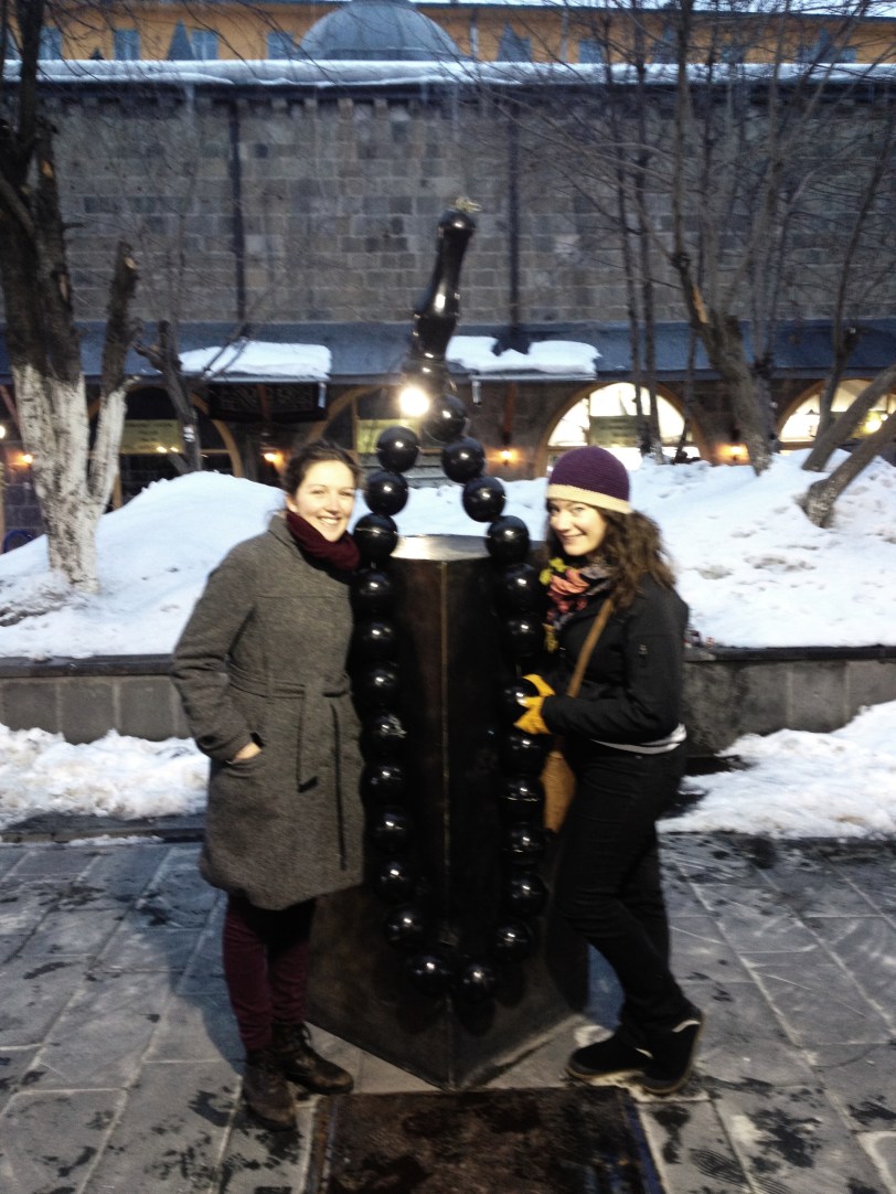 Posing with some large prayer beads in the Taşhan courtyard