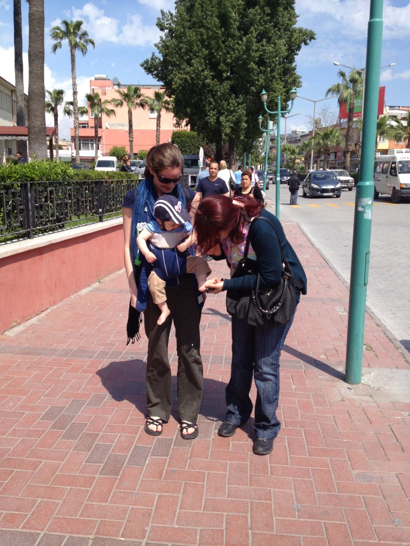 Passerby stopping to pinch his feet