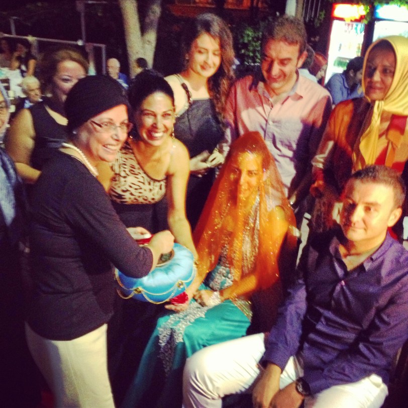 Their families gathered around the couple during the henna ceremony