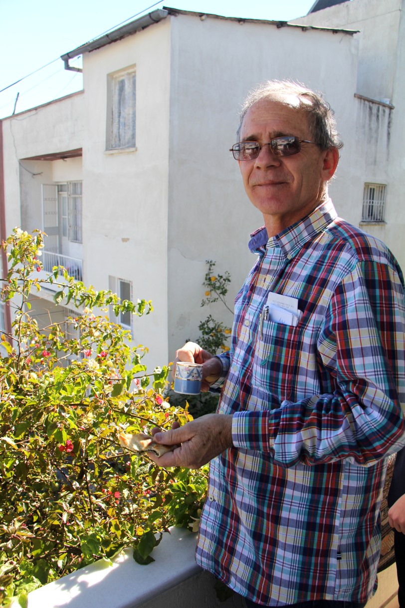 Dad checking out the fruit growing off the balcony in Tarsus